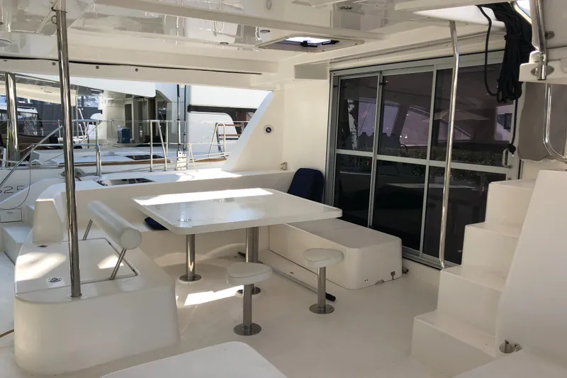 Slide: The Image of Luxurious 2017 Leopard 48 yacht interior with modern seating and dining area. - 11