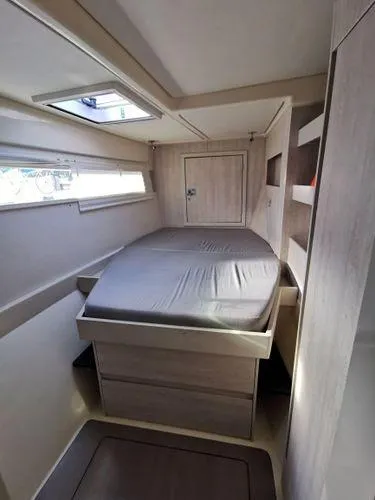 Slide: The Image of 2017 Leopard 48 yacht cabin with bed, skylight, and modern interior design. - 15