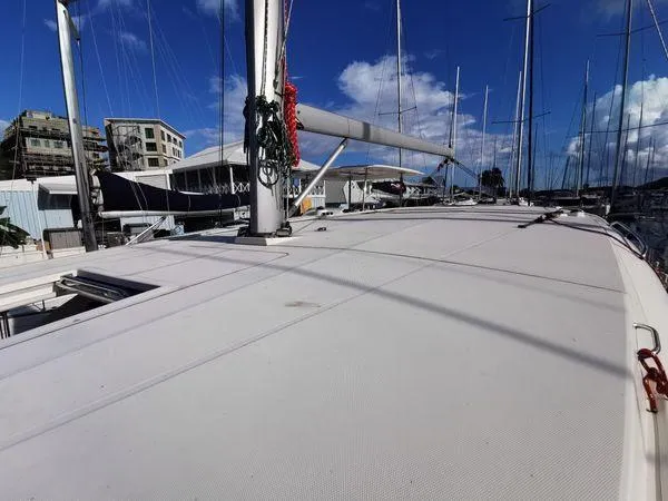 Slide: The Image of 2017 Leopard 48 yacht deck in marina, clear sky, and surrounding boats. - 7