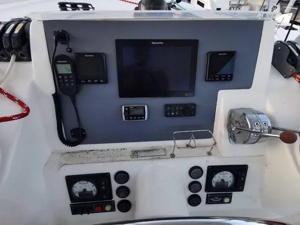 Slide: The Image of Control panel of a 2017 Leopard 48 yacht with navigation and communication equipment. - 9