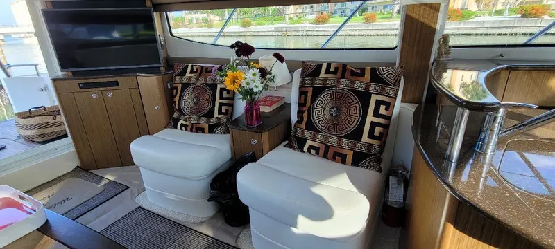 Slide: The Image of Interior of 2016 Meridian 391 Sedan with cozy seating and decorative pillows. - 12