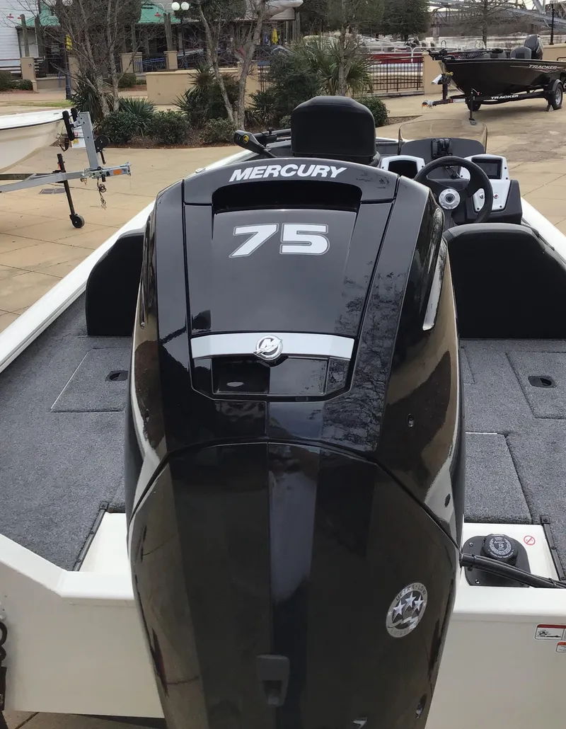 Slide: The Image of 2025 Tracker Pro Team 175 boat with Mercury 75 engine, parked outdoors. - 3