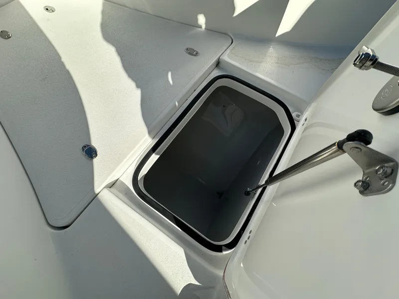 Slide: The Image of Open storage compartment on 2025 Sea Pro 322 Offshore boat deck. - 14
