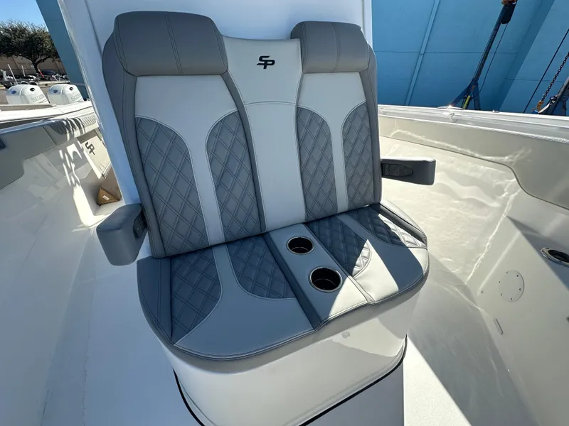 Slide: The Image of 2025 Sea Pro 322 Offshore boat seat with cup holders, featuring gray and white upholstery. - 15