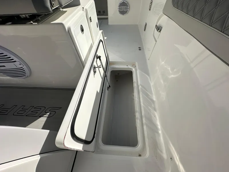 Slide: The Image of 2025 Sea Pro 322 Offshore boat interior with open storage compartment. - 17