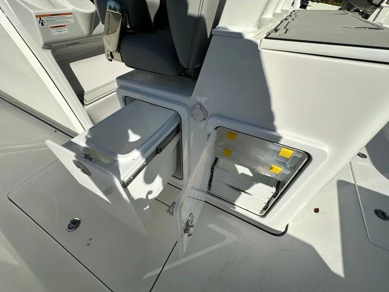 Slide: The Image of 2025 Sea Pro 322 Offshore boat storage compartments and seating area. - 18