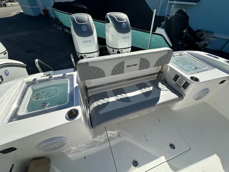 Slide: The Image of 2025 Sea Pro 322 Offshore boat interior with dual engines and seating. - 21