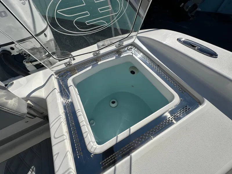 Slide: The Image of 2025 Sea Pro 322 Offshore livewell with open lid, showcasing interior design. - 23