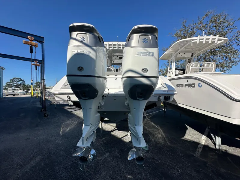 Slide: The Image of 2025 Sea Pro 322 Offshore boat with dual 350 engines, parked outdoors. - 3