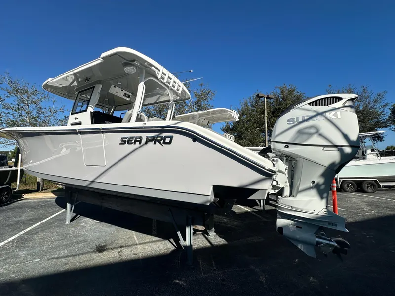 Slide: The Image of 2025 Sea Pro 322 Offshore boat with Suzuki engine, displayed outdoors. - 4