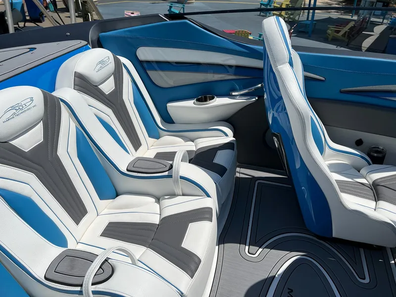 Slide: The Image of Luxury interior of 2022 MTI 390X boat with blue and white seating. - 10