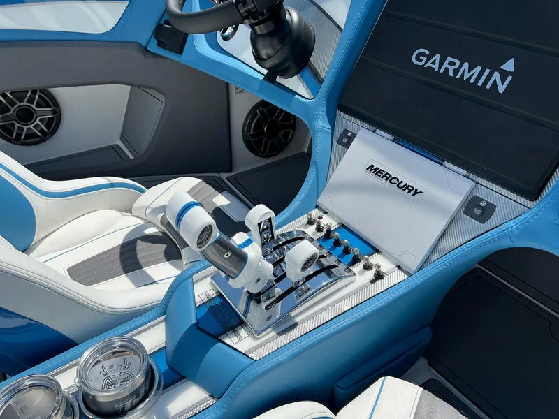 Slide: The Image of Luxury MTI 390X boat interior with Garmin navigation and Mercury controls, 2022 model. - 12