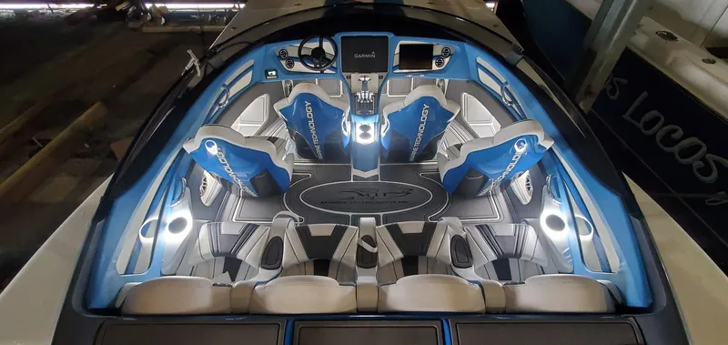 Slide: The Image of Luxurious 2022 MTI 390X boat interior with blue seating and ambient lighting. - 15