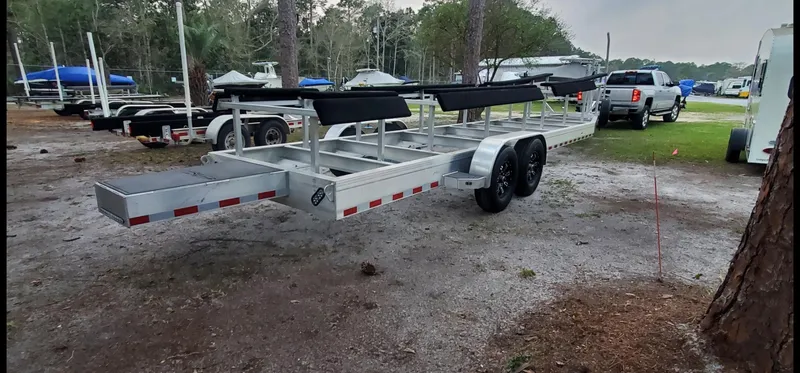 Slide: The Image of MTI 390X 2022 boat trailer in outdoor setting, featuring dual axles and sturdy construction. - 17
