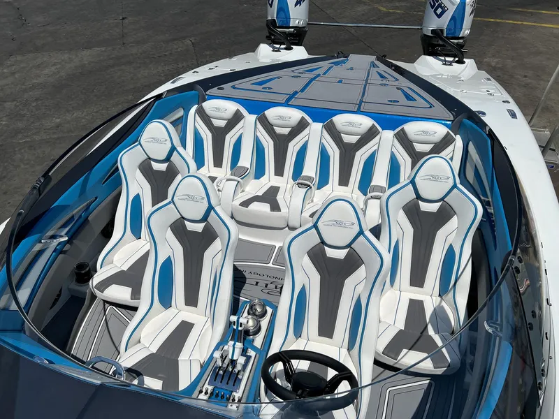 Slide: The Image of 2022 MTI 390X boat with sleek seating and modern design. - 8