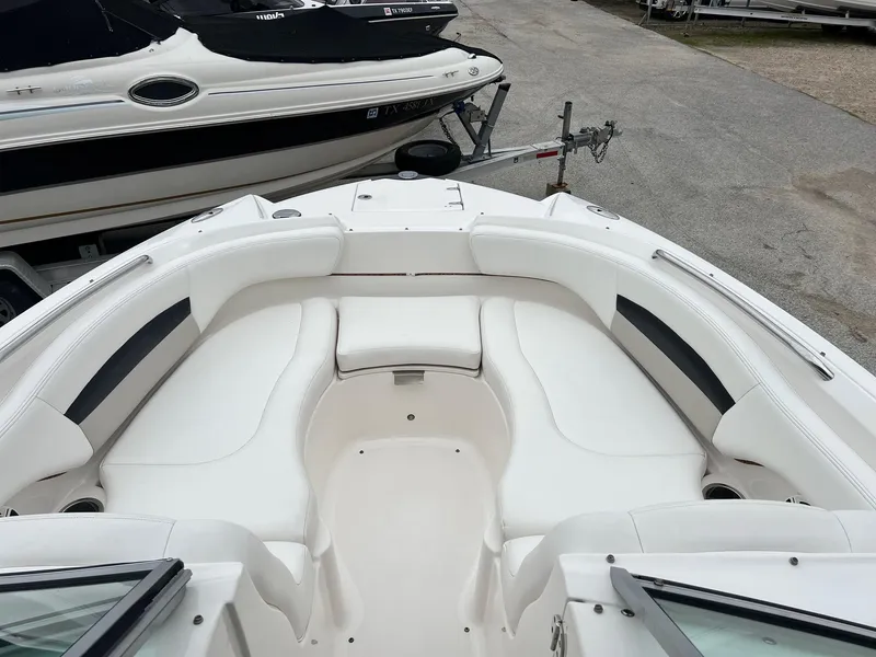 Slide: The Image of 2011 Chaparral Sunesta 244 Xtreme boat interior with white seating and sleek design. - 12