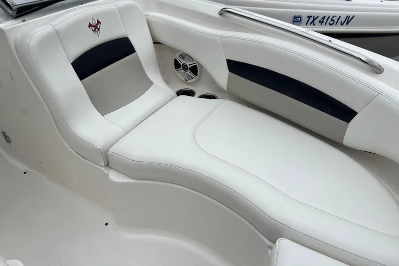 Slide: The Image of 2011 Chaparral Sunesta 244 Xtreme boat interior with white leather seating. - 14