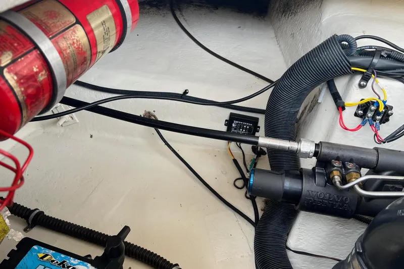 Slide: The Image of Engine compartment of 2011 Chaparral Sunesta 244 Xtreme with Volvo Penta components and fire extinguisher. - 26