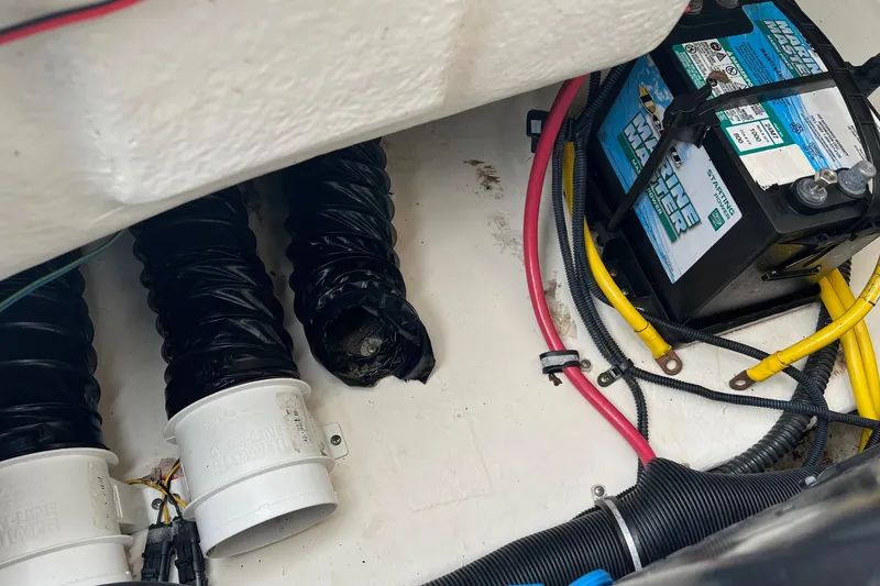 Slide: The Image of 2011 Chaparral Sunesta 244 Xtreme boat interior with battery and ventilation system. - 28