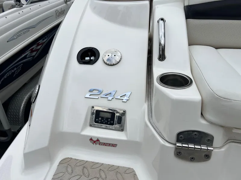 Slide: The Image of 2011 Chaparral Sunesta 244 Xtreme boat detail with seating and control panel. - 3