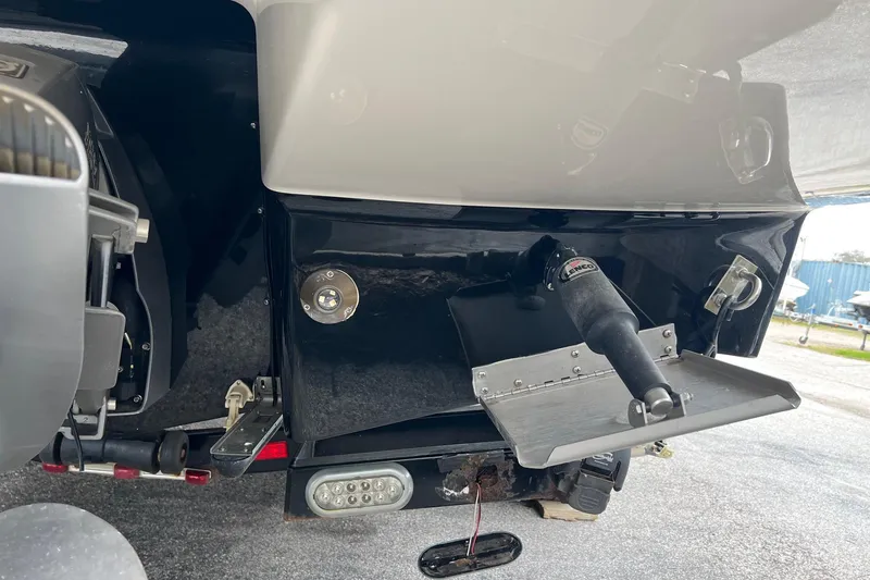 Slide: The Image of 2011 Chaparral Sunesta 244 Xtreme boat stern with trim tab and propeller details. - 32