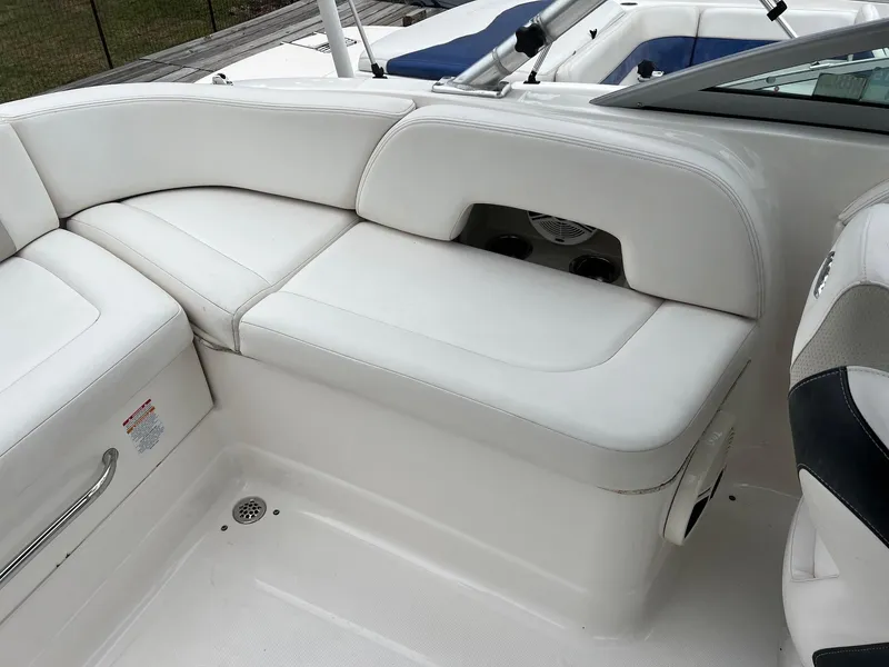 Slide: The Image of 2011 Chaparral Sunesta 244 Xtreme boat interior with white seating. - 7