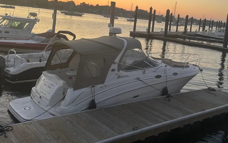 Slide: The Image of 2002 Sea Ray Sundancer docked at sunset, calm marina waters. - 16