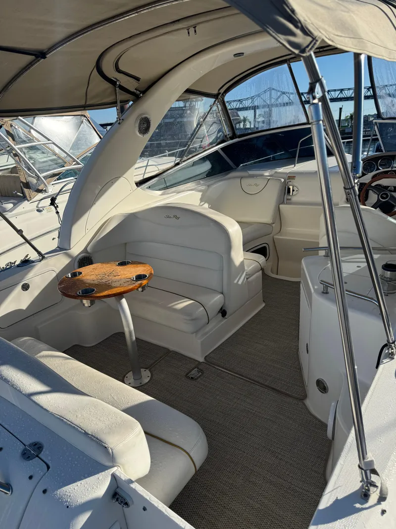 Slide: The Image of Interior of 2002 Sea Ray Sundancer boat with seating and table. - 8