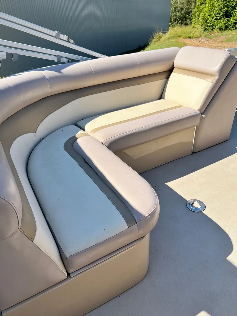 Slide: The Image of 2014 Crest 210FC boat seating with beige and cream upholstery. - 3