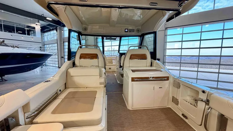 Slide: The Image of 2024 Chris-Craft Calypso 32 CT interior with luxurious seating and modern design. - 13