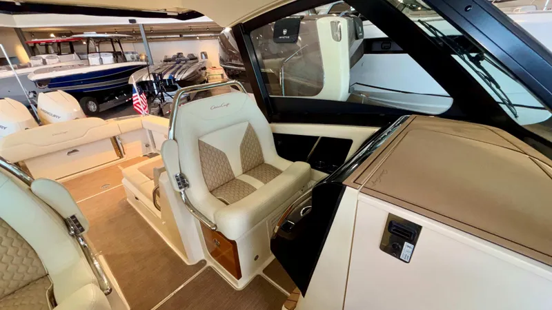 Slide: The Image of 2024 Chris-Craft Calypso 32 CT interior with luxurious seating and modern design. - 27