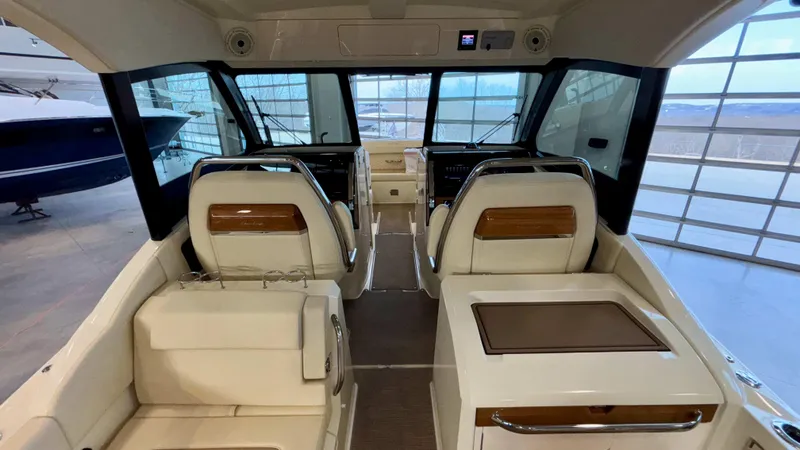 Slide: The Image of 2024 Chris-Craft Calypso 32 CT interior with luxurious seating and modern dashboard. - 29