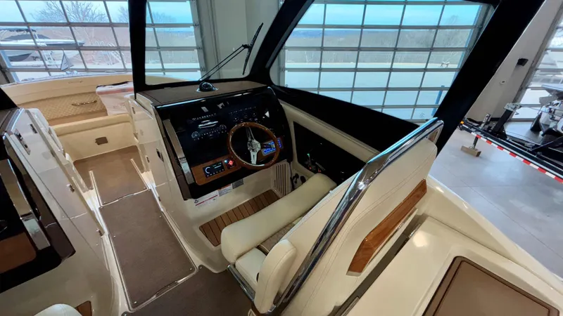Slide: The Image of 2024 Chris-Craft Calypso 32 CT helm with luxurious interior and modern controls. - 30