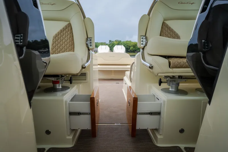 Slide: The Image of Luxurious interior of 2024 Chris-Craft Calypso 32 boat with plush seating and storage. - 58