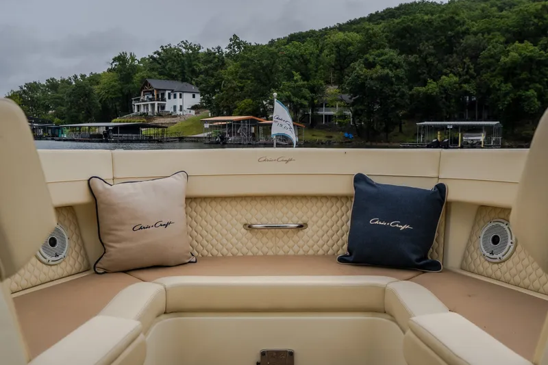 Slide: The Image of 2024 Chris-Craft Calypso 32 interior with luxury seating and scenic waterfront view. - 51
