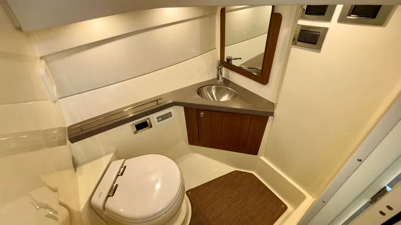 Slide: The Image of 2024 Chris-Craft Calypso 32 CT bathroom with modern fixtures and compact design. - 36