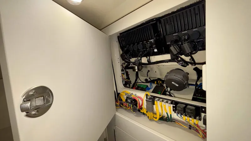 Slide: The Image of 2024 Chris-Craft Calypso 32 CT electrical panel with wiring and components. - 41