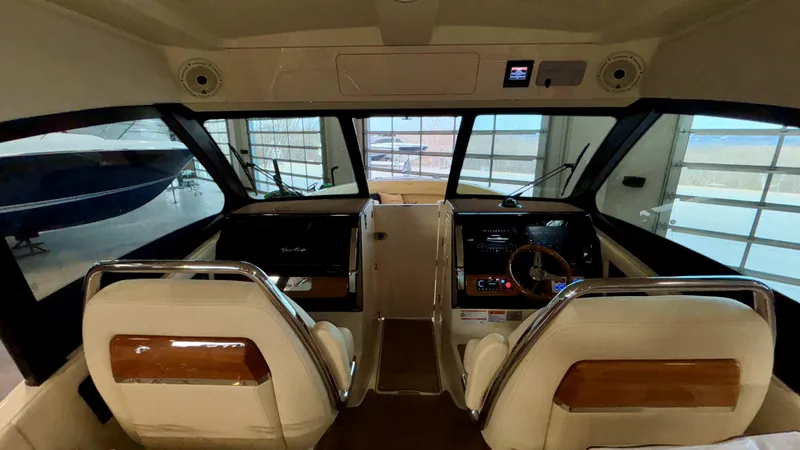 Slide: The Image of 2024 Chris-Craft Calypso 32 CT cockpit with dual seats and modern dashboard. - 42