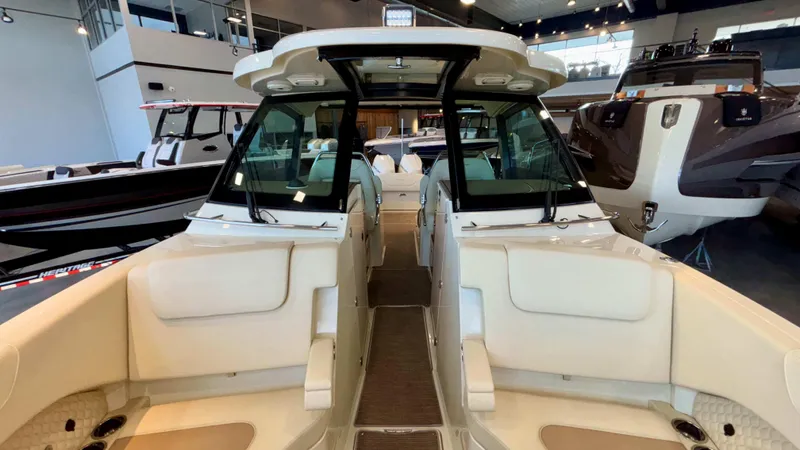 Slide: The Image of 2024 Chris-Craft Calypso 32 CT boat interior, showcasing luxurious seating and modern design. - 44