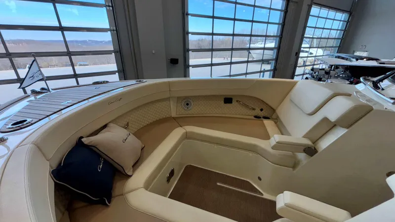 Slide: The Image of 2024 Chris-Craft Calypso 32 CT interior with luxurious seating and elegant design. - 46