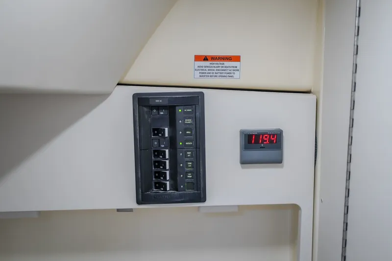 Slide: The Image of Electrical panel and voltage display on 2024 Chris-Craft Calypso 32 boat. - 73