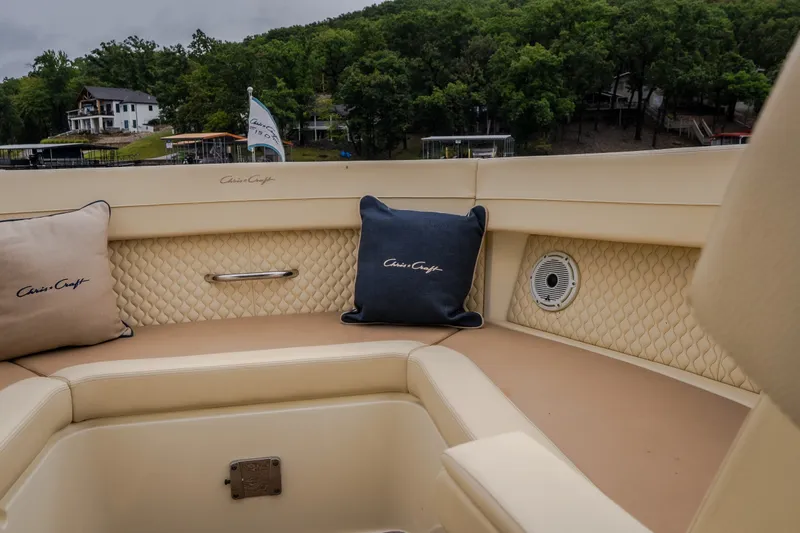 Slide: The Image of Luxurious seating on 2024 Chris-Craft Calypso 32 boat with elegant cushions and scenic backdrop. - 52
