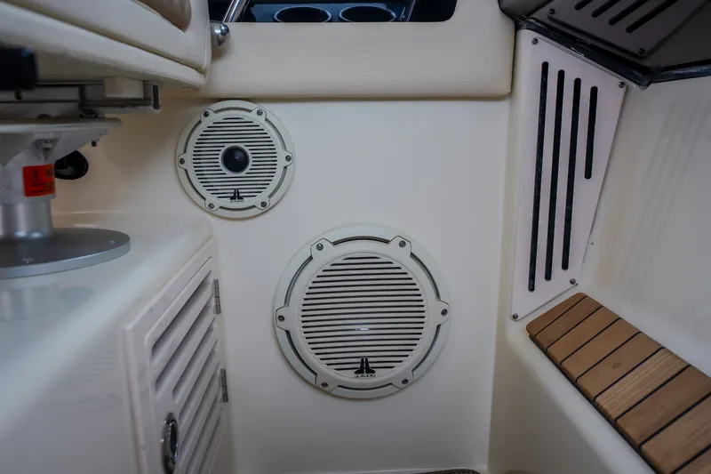 Slide: The Image of 2024 Chris-Craft Calypso 32 interior speakers and seating detail. - 48
