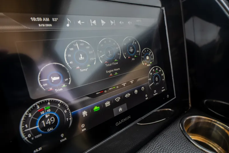 Slide: The Image of Dashboard display of 2024 Chris-Craft Calypso 32 with digital gauges and controls. - 41