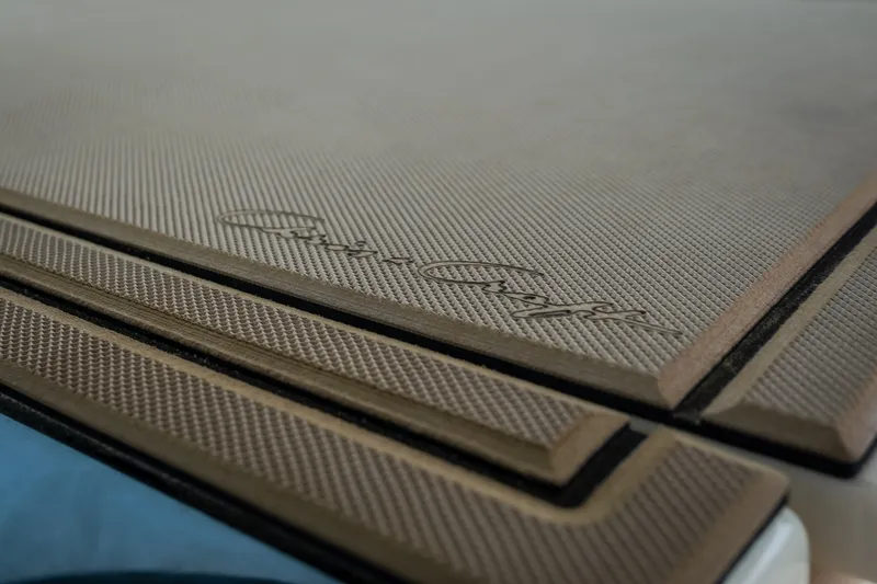 Slide: The Image of Close-up of 2024 Chris-Craft Calypso 32 textured deck with logo. - 47