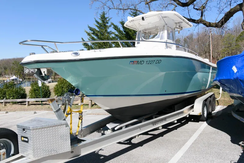 Slide: The Image of 2008 Century 2901 Center Console boat on trailer in parking lot. - 1