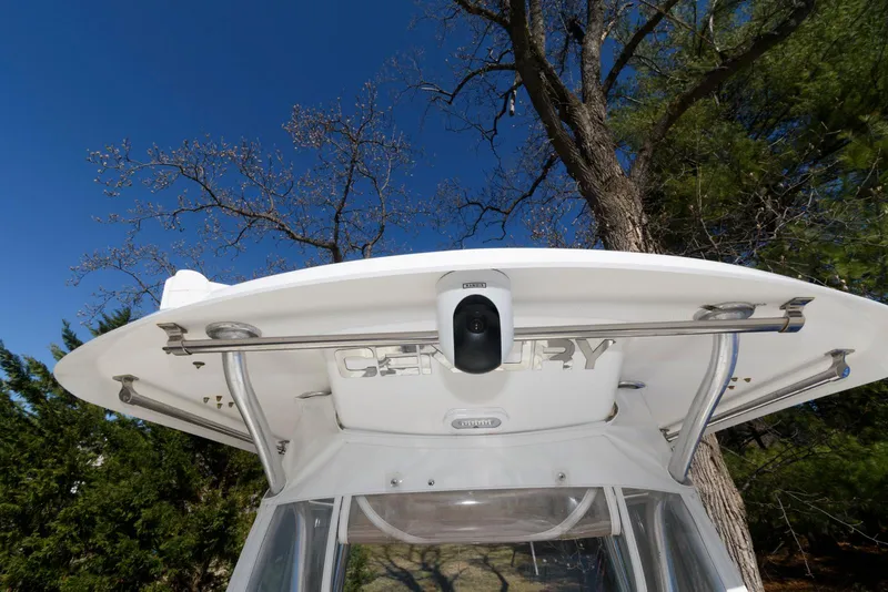 Slide: The Image of 2008 Century 2901 Center Console boat with clear blue sky and trees in the background. - 12