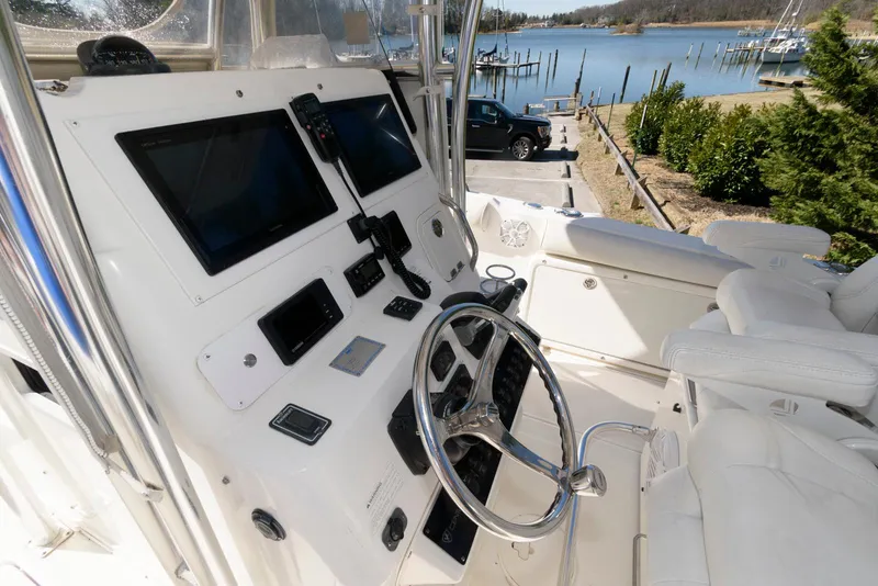 Slide: The Image of 2008 Century 2901 Center Console boat interior with steering wheel and control panel. - 7