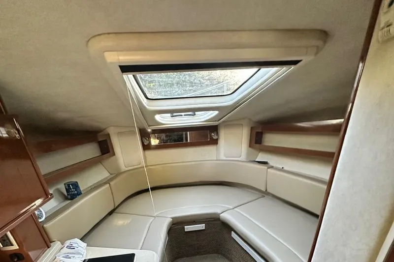 Slide: The Image of Interior cabin of 2013 Sea Ray 280 Sundancer with skylight and seating. - 14