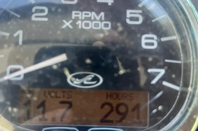 Slide: The Image of Close-up of 2013 Sea Ray 280 Sundancer gauge showing 11.7 volts and 291 hours. - 4